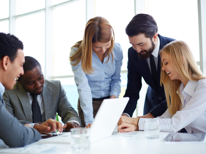 Group of business partners discussing ideas and planning work in office